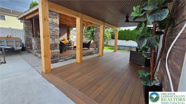 1136 Ashbourne Dr, Muhlenberg Twp, PA 19605 - wooden deck featuring a ceiling fan