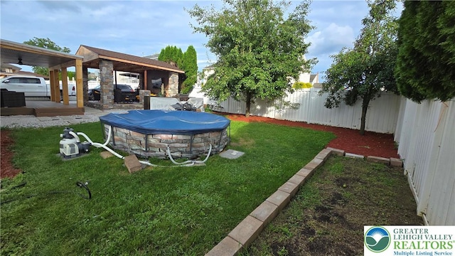 1136 Ashbourne Dr, Muhlenberg Twp, PA 19605 - fenced backyard with ceiling fan