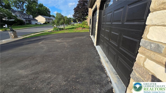 1136 Ashbourne Dr, Muhlenberg Twp, PA 19605 - view of asphalt road featuring a residential view