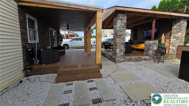 1136 Ashbourne Dr, Muhlenberg Twp, PA 19605 - view of patio featuring a ceiling fan and a deck