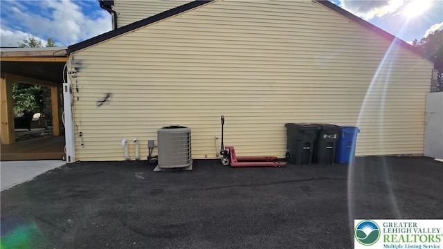 1136 Ashbourne Dr, Muhlenberg Twp, PA 19605 - view of side of home featuring a central air condition unit