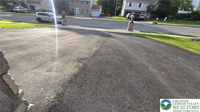 1136 Ashbourne Dr, Muhlenberg Twp, PA 19605 - view of asphalt road featuring a residential view