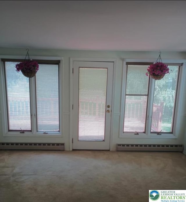6059 Clubhouse Ln, Lower Macungie Twp, PA 18106 - doorway to outside with a baseboard radiator, carpet flooring, and plenty of natural light