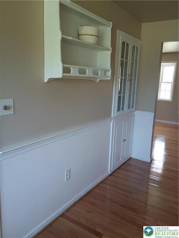 6059 Clubhouse Ln, Lower Macungie Twp, PA 18106 - unfurnished dining area featuring wood finished floors and baseboards