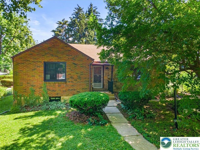 1321 W Union Blvd, Bethlehem City, PA 18018 - view of front of house featuring a front yard and brick siding