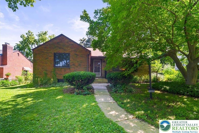 1321 W Union Blvd, Bethlehem City, PA 18018 - view of front facade featuring brick siding and a front yard
