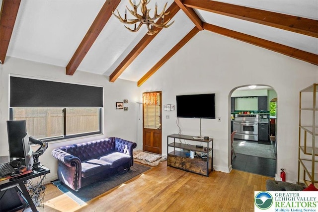 1321 W Union Blvd, Bethlehem City, PA 18018 - living area featuring arched walkways, wood finished floors, beamed ceiling, and high vaulted ceiling