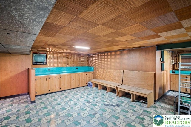 1321 W Union Blvd, Bethlehem City, PA 18018 - miscellaneous room with wood walls and tile patterned floors