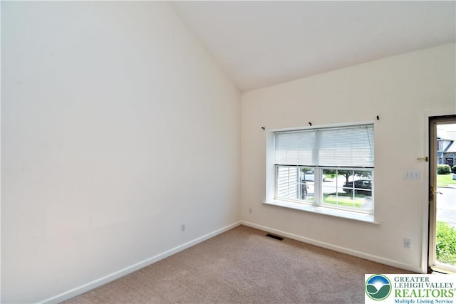 5631 Stonecroft Ln, Lower Macungie Twp, PA 18106 - carpeted empty room with baseboards and lofted ceiling