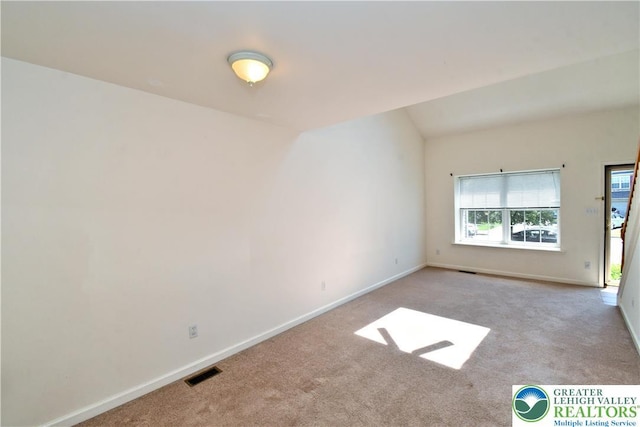 5631 Stonecroft Ln, Lower Macungie Twp, PA 18106 - carpeted empty room with baseboards and vaulted ceiling