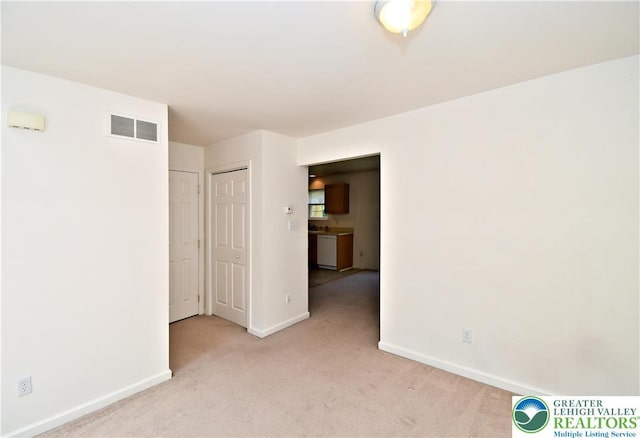 5631 Stonecroft Ln, Lower Macungie Twp, PA 18106 - spare room featuring light carpet and baseboards