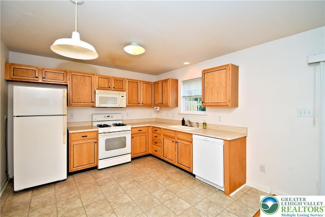 5631 Stonecroft Ln, Lower Macungie Twp, PA 18106 - kitchen featuring white appliances, light countertops, and hanging light fixtures
