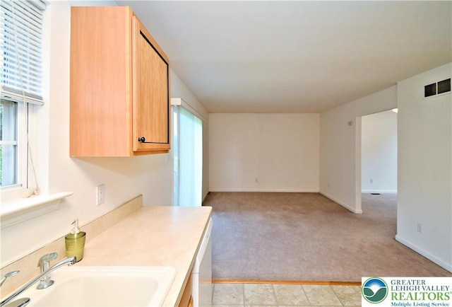 5631 Stonecroft Ln, Lower Macungie Twp, PA 18106 - kitchen featuring light carpet, light countertops, open floor plan, light brown cabinets, and dishwasher