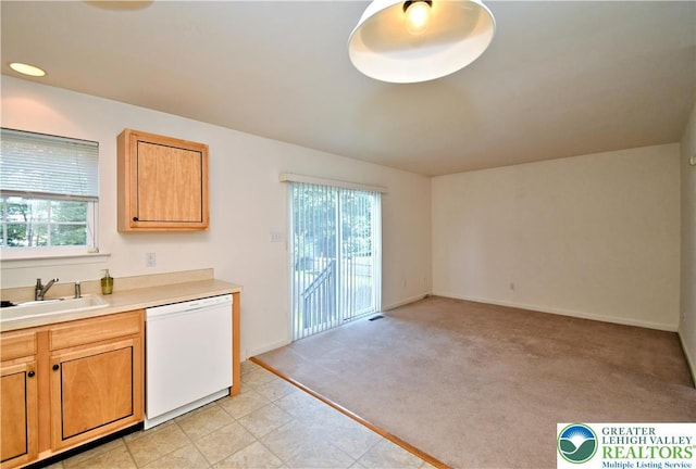 5631 Stonecroft Ln, Lower Macungie Twp, PA 18106 - kitchen featuring white dishwasher, healthy amount of natural light, light countertops, and light carpet