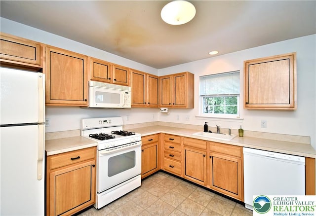 5631 Stonecroft Ln, Lower Macungie Twp, PA 18106 - kitchen featuring white appliances, light countertops, recessed lighting, and brown cabinets