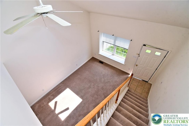 5631 Stonecroft Ln, Lower Macungie Twp, PA 18106 - staircase with a ceiling fan, carpet, and vaulted ceiling