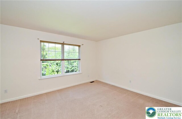 5631 Stonecroft Ln, Lower Macungie Twp, PA 18106 - unfurnished room featuring baseboards and light colored carpet