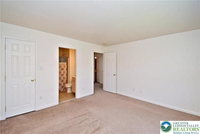 5631 Stonecroft Ln, Lower Macungie Twp, PA 18106 - unfurnished bedroom featuring carpet flooring and connected bathroom