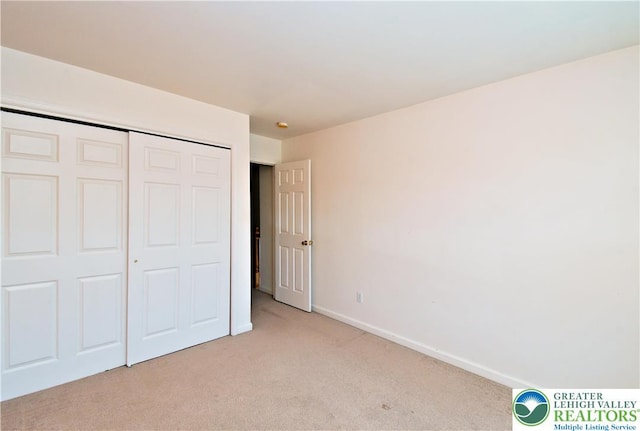 5631 Stonecroft Ln, Lower Macungie Twp, PA 18106 - unfurnished bedroom featuring light colored carpet and a closet