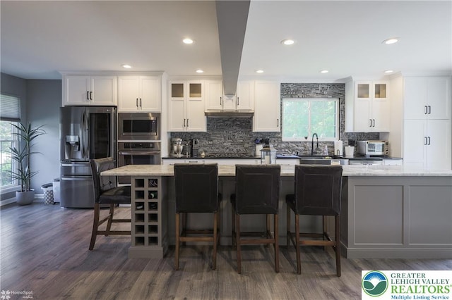 3536 New Hampshire Ave, Bethlehem Twp, PA 18045 - kitchen featuring appliances with stainless steel finishes, tasteful backsplash, dark wood-style flooring, recessed lighting, and glass insert cabinets