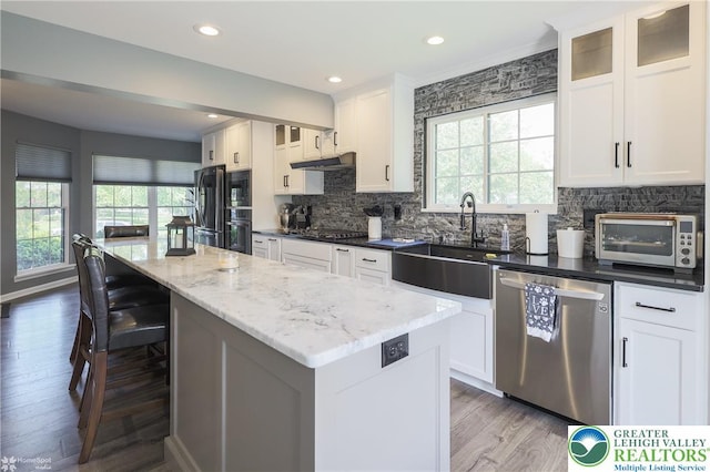 3536 New Hampshire Ave, Bethlehem Twp, PA 18045 - kitchen with black appliances, healthy amount of natural light, backsplash, and recessed lighting
