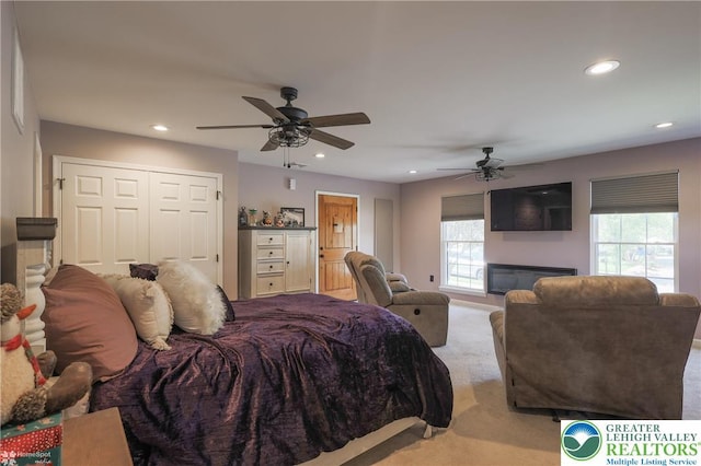 3536 New Hampshire Ave, Bethlehem Twp, PA 18045 - bedroom with light carpet, recessed lighting, ceiling fan, and a glass covered fireplace