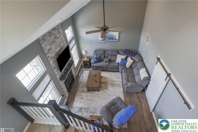 3536 New Hampshire Ave, Bethlehem Twp, PA 18045 - living area with a towering ceiling, wood finished floors, a fireplace, and a ceiling fan