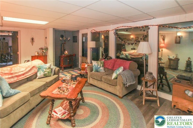 518 Bauer Rd, Moore Twp, PA 18014 - living room with a wood stove, a paneled ceiling, and wood finished floors