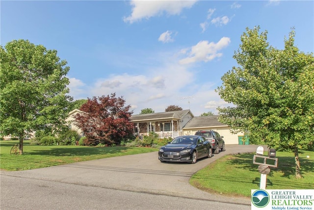 518 Bauer Rd, Moore Twp, PA 18014 - view of front of home featuring driveway, a front yard, and a garage