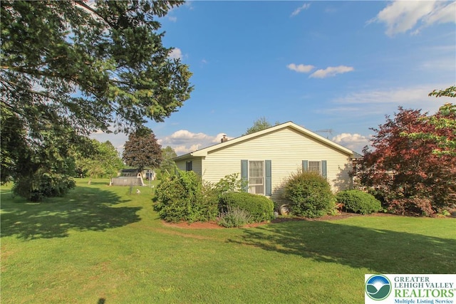 518 Bauer Rd, Moore Twp, PA 18014 - view of property exterior featuring a yard and a chimney
