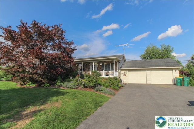 518 Bauer Rd, Moore Twp, PA 18014 - view of front of home with covered porch, a front lawn, a garage, and driveway