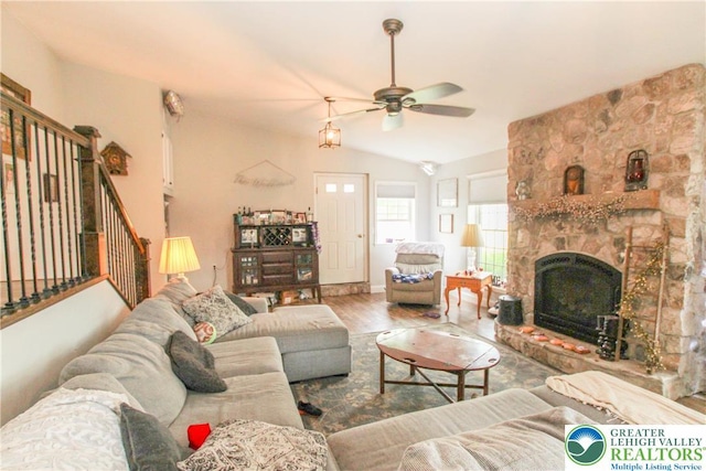 518 Bauer Rd, Moore Twp, PA 18014 - living room with a ceiling fan, wood finished floors, stairway, vaulted ceiling, and a stone fireplace
