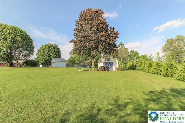 518 Bauer Rd, Moore Twp, PA 18014 - view of grassy yard featuring a trampoline and a storage shed
