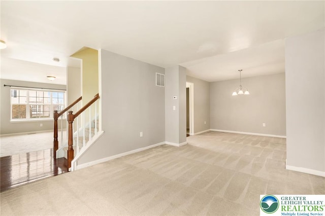 4094 Bunker Hill Dr S, Upper Saucon Twp, PA 18036 - empty room featuring light carpet, a chandelier, and stairs