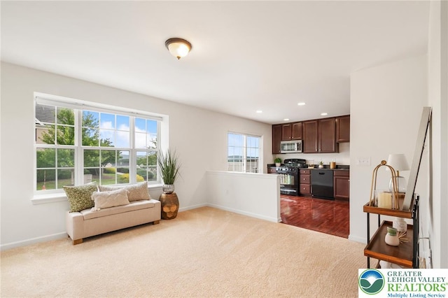 4094 Bunker Hill Dr S, Upper Saucon Twp, PA 18036 - kitchen with stainless steel microwave, dishwashing machine, black range with gas cooktop, dark colored carpet, and open floor plan