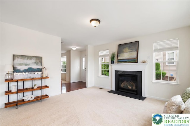 4094 Bunker Hill Dr S, Upper Saucon Twp, PA 18036 - living area featuring carpet floors and a fireplace with flush hearth