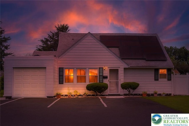 2912 Lehigh St, Allentown City, PA 18103 - view of front of house with an attached garage and roof mounted solar panels