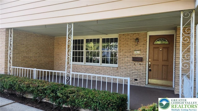 2425 Pennsylvania St, South Whitehall Twp, PA 18104 - property entrance with covered porch and brick siding