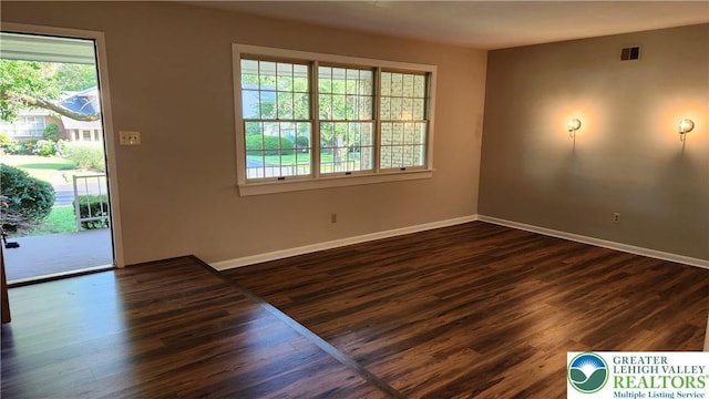 2425 Pennsylvania St, South Whitehall Twp, PA 18104 - empty room featuring plenty of natural light and dark wood finished floors