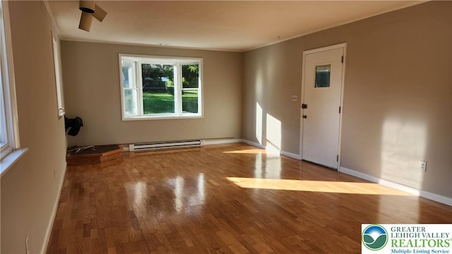 2425 Pennsylvania St, South Whitehall Twp, PA 18104 - unfurnished room featuring ornamental molding, baseboard heating, and wood finished floors
