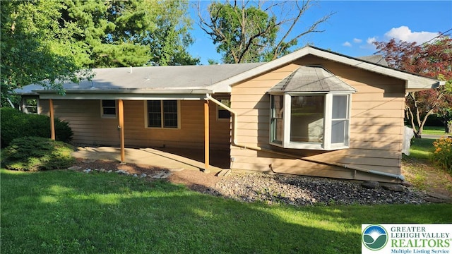 2425 Pennsylvania St, South Whitehall Twp, PA 18104 - view of side of property featuring a lawn and a patio area