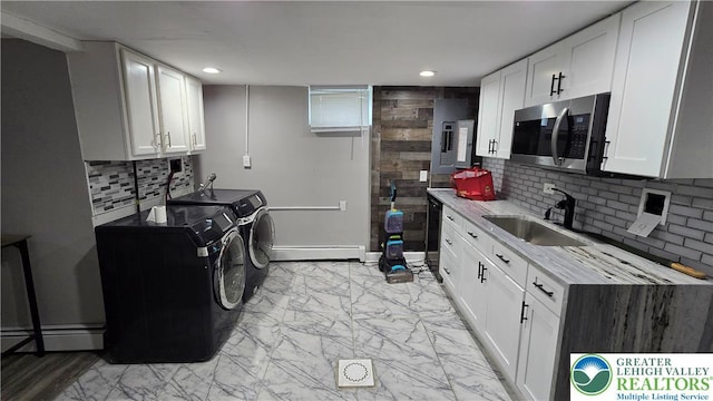 1500 Schuylkill Ave, Reading City, PA 19601 - laundry area with independent washer and dryer, electric panel, recessed lighting, light marble finish floors, and a baseboard heating unit