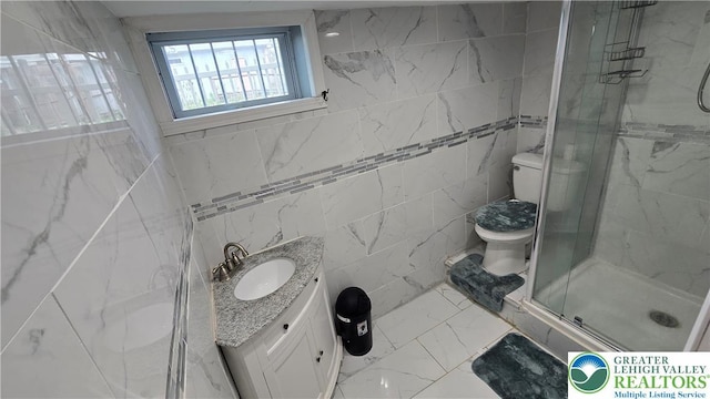 1500 Schuylkill Ave, Reading City, PA 19601 - bathroom featuring marble look tile flooring, a shower stall, vanity, and tile walls