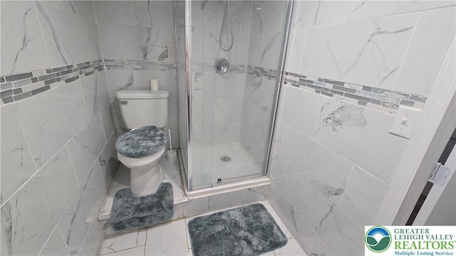 1500 Schuylkill Ave, Reading City, PA 19601 - bathroom featuring a stall shower, marble look tiles, and tile walls