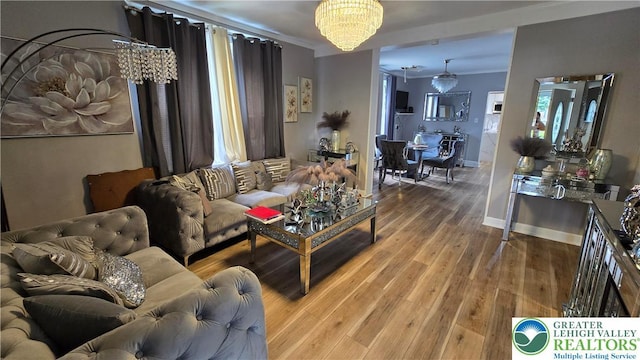 1500 Schuylkill Ave, Reading City, PA 19601 - living room featuring a chandelier, ornamental molding, and wood finished floors