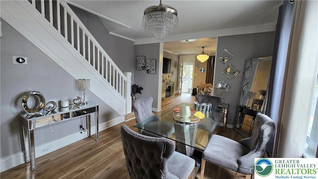 1500 Schuylkill Ave, Reading City, PA 19601 - dining space featuring stairway, wood finished floors, ornamental molding, and a chandelier