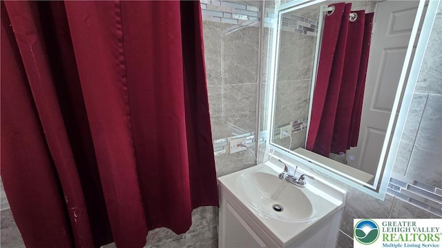1500 Schuylkill Ave, Reading City, PA 19601 - bathroom with vanity and tile walls