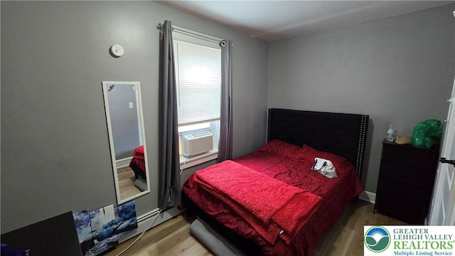 1500 Schuylkill Ave, Reading City, PA 19601 - bedroom with wood finished floors and cooling unit