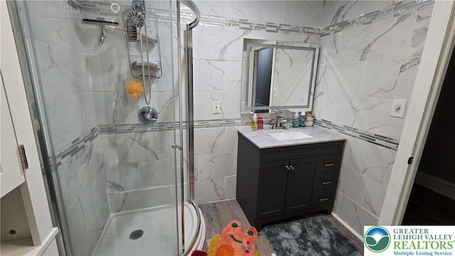 1500 Schuylkill Ave, Reading City, PA 19601 - bathroom with a shower stall, vanity, and tile walls