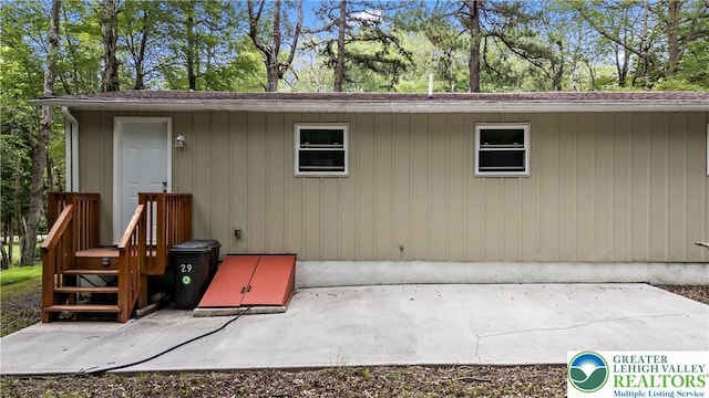 29 Long Brook Way, Penn Forest Twp, PA 18210 - rear view of property with view of wooded area